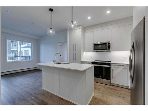 1121-395 Skyview Parkway Ne, Calgary, AB - Indoor Photo Showing Kitchen With Upgraded Kitchen