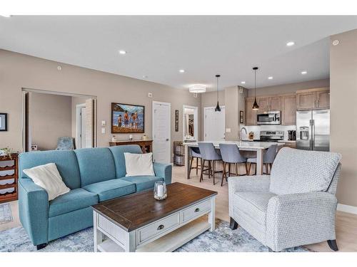 310-106 Stewart Creek Rise, Canmore, AB - Indoor Photo Showing Living Room