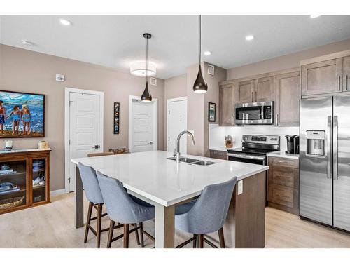 310-106 Stewart Creek Rise, Canmore, AB - Indoor Photo Showing Kitchen With Double Sink With Upgraded Kitchen