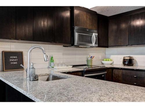 219-15 Aspenmont Heights Sw, Calgary, AB - Indoor Photo Showing Kitchen With Upgraded Kitchen