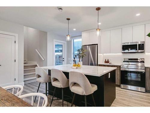 2-923 1 Avenue Nw, Calgary, AB - Indoor Photo Showing Kitchen With Double Sink With Upgraded Kitchen