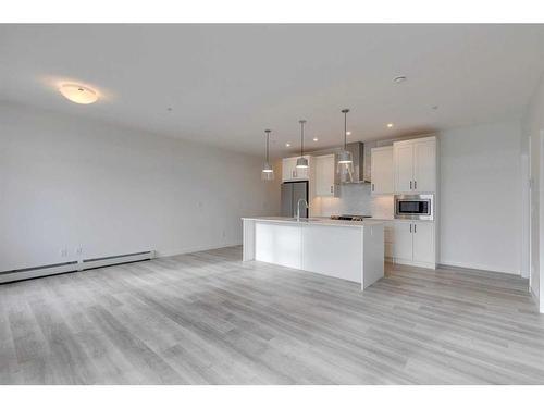 103-60 Sage Hill Walk Nw, Calgary, AB - Indoor Photo Showing Kitchen With Upgraded Kitchen