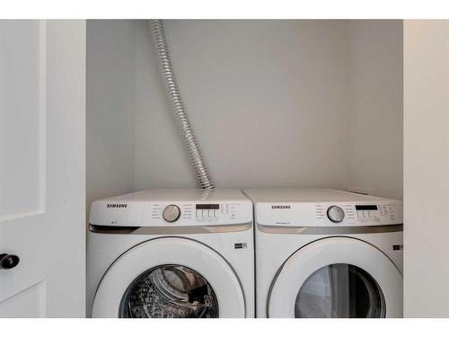 103-60 Sage Hill Walk Nw, Calgary, AB - Indoor Photo Showing Laundry Room