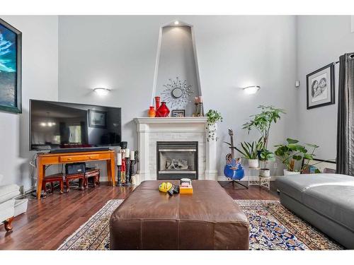 73 Weston Way Sw, Calgary, AB - Indoor Photo Showing Living Room With Fireplace