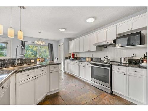 73 Weston Way Sw, Calgary, AB - Indoor Photo Showing Kitchen With Double Sink With Upgraded Kitchen