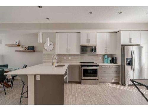 40 Legacy Path Se, Calgary, AB - Indoor Photo Showing Kitchen With Stainless Steel Kitchen With Double Sink With Upgraded Kitchen