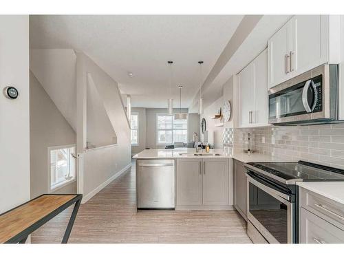 40 Legacy Path Se, Calgary, AB - Indoor Photo Showing Kitchen With Stainless Steel Kitchen With Upgraded Kitchen