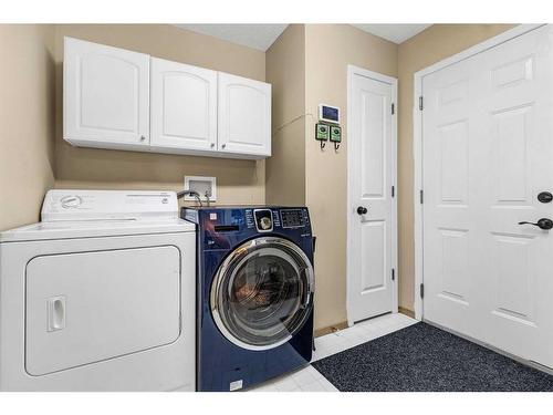 1093 Cranston Drive Se, Calgary, AB - Indoor Photo Showing Laundry Room