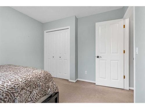 1093 Cranston Drive Se, Calgary, AB - Indoor Photo Showing Bedroom