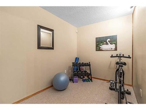 1093 Cranston Drive Se, Calgary, AB - Indoor Photo Showing Gym Room