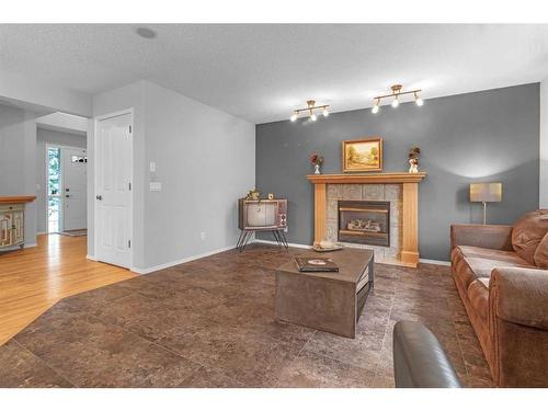 1093 Cranston Drive Se, Calgary, AB - Indoor Photo Showing Living Room With Fireplace