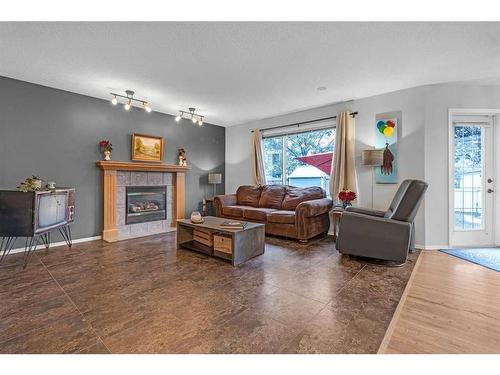 1093 Cranston Drive Se, Calgary, AB - Indoor Photo Showing Living Room With Fireplace