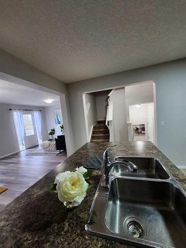 124 Windstone Link Sw, Airdrie, AB - Indoor Photo Showing Kitchen With Double Sink