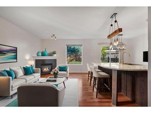 24 Tuscarora Place Nw, Calgary, AB - Indoor Photo Showing Living Room With Fireplace