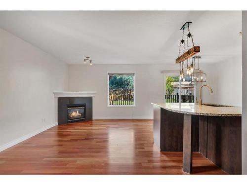 24 Tuscarora Place Nw, Calgary, AB - Indoor Photo Showing Living Room With Fireplace