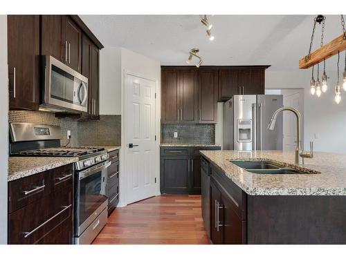 24 Tuscarora Place Nw, Calgary, AB - Indoor Photo Showing Kitchen With Double Sink With Upgraded Kitchen