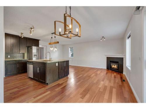 24 Tuscarora Place Nw, Calgary, AB - Indoor Photo Showing Kitchen With Fireplace With Upgraded Kitchen