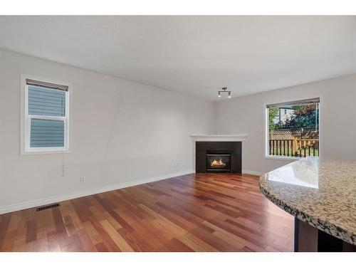 24 Tuscarora Place Nw, Calgary, AB - Indoor Photo Showing Living Room With Fireplace