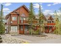 102-800 Wilson Way, Canmore, AB  - Outdoor With Deck Patio Veranda With Facade 