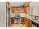 102-800 Wilson Way, Canmore, AB  - Indoor Photo Showing Kitchen With Stainless Steel Kitchen With Double Sink 