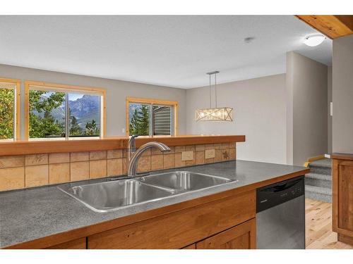 102-800 Wilson Way, Canmore, AB - Indoor Photo Showing Kitchen With Double Sink