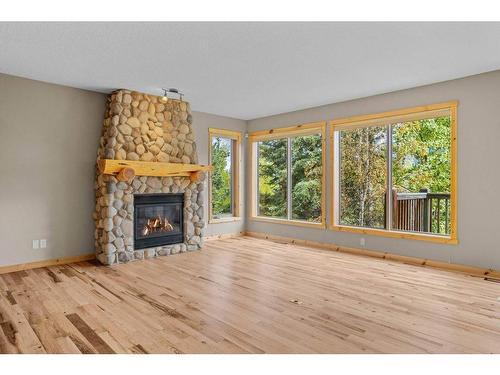 102-800 Wilson Way, Canmore, AB - Indoor Photo Showing Living Room With Fireplace