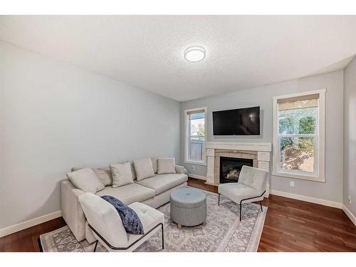 73 Cranleigh Heath Se, Calgary, AB - Indoor Photo Showing Living Room With Fireplace