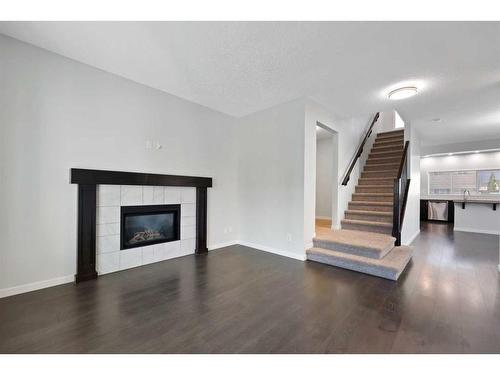 80 Copperpond Parade Se, Calgary, AB - Indoor Photo Showing Living Room With Fireplace