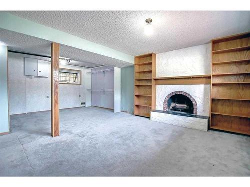 331 Huntridge Road Ne, Calgary, AB - Indoor With Fireplace