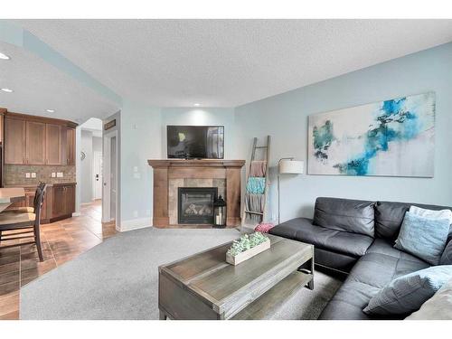 13 Brightoncrest Grove Se, Calgary, AB - Indoor Photo Showing Living Room With Fireplace