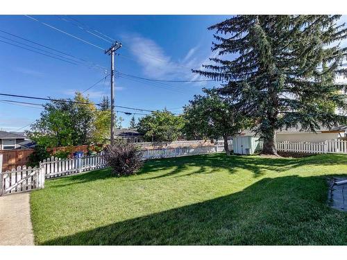 48 Malibou Road Sw, Calgary, AB - Outdoor With Backyard