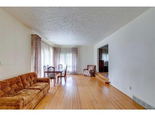 48 Malibou Road Sw, Calgary, AB - Indoor Photo Showing Living Room