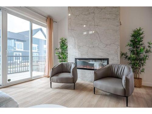 1372 Scarlett Ranch Boulevard, Carstairs, AB - Indoor Photo Showing Living Room With Fireplace