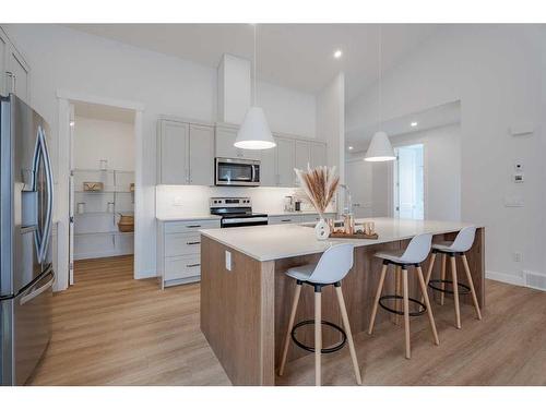 1372 Scarlett Ranch Boulevard, Carstairs, AB - Indoor Photo Showing Kitchen With Stainless Steel Kitchen With Upgraded Kitchen