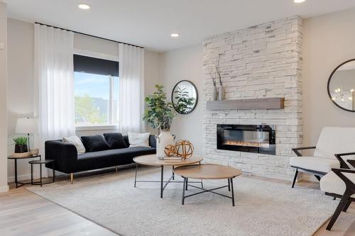 55 Mallard Heath Se, Calgary, AB - Indoor Photo Showing Living Room With Fireplace