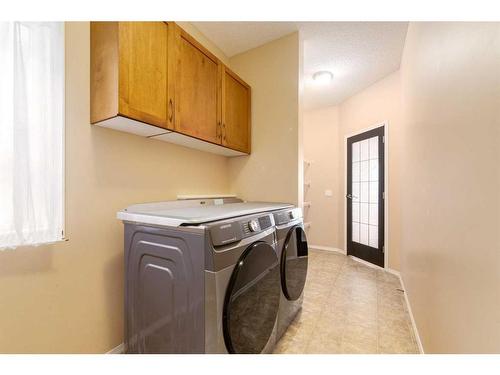 72 Sunset Close, Cochrane, AB - Indoor Photo Showing Laundry Room