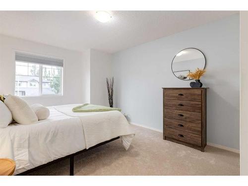 72 Sunset Close, Cochrane, AB - Indoor Photo Showing Bedroom