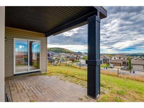 72 Sunset Close, Cochrane, AB - Outdoor With Deck Patio Veranda With Exterior