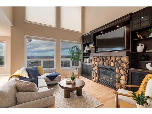 72 Sunset Close, Cochrane, AB - Indoor Photo Showing Living Room With Fireplace