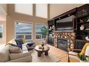 72 Sunset Close, Cochrane, AB  - Indoor Photo Showing Living Room With Fireplace 