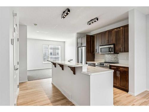 106 Chapalina Square Se, Calgary, AB - Indoor Photo Showing Kitchen With Stainless Steel Kitchen With Upgraded Kitchen