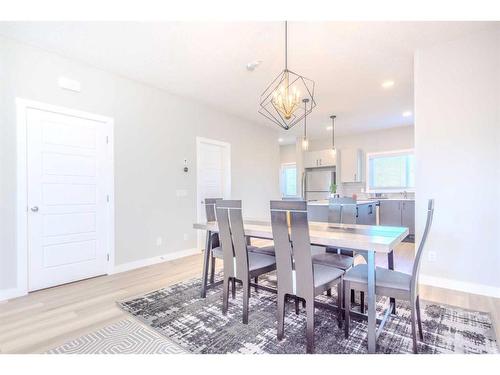 831 Creekside Boulevard Sw, Calgary, AB - Indoor Photo Showing Dining Room