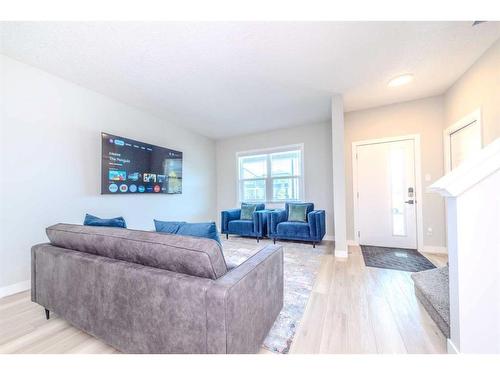 831 Creekside Boulevard Sw, Calgary, AB - Indoor Photo Showing Living Room