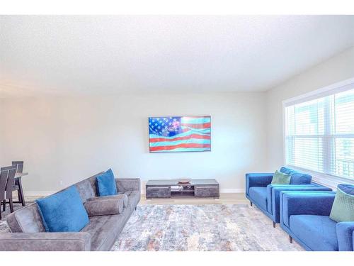 831 Creekside Boulevard Sw, Calgary, AB - Indoor Photo Showing Living Room