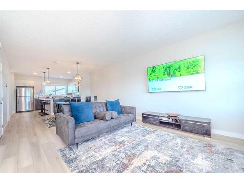 831 Creekside Boulevard Sw, Calgary, AB - Indoor Photo Showing Living Room