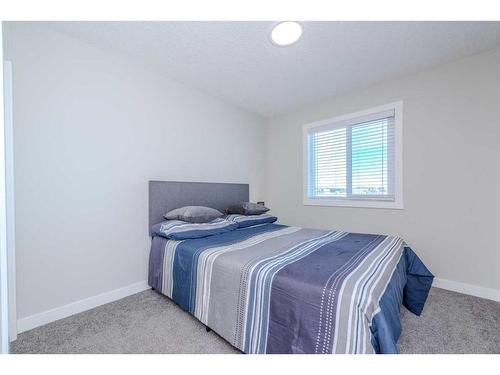 831 Creekside Boulevard Sw, Calgary, AB - Indoor Photo Showing Bedroom