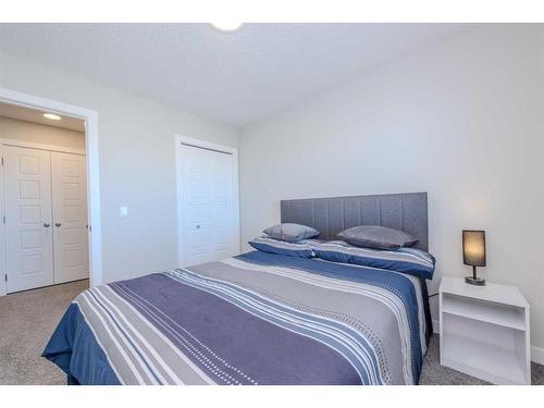 831 Creekside Boulevard Sw, Calgary, AB - Indoor Photo Showing Bedroom