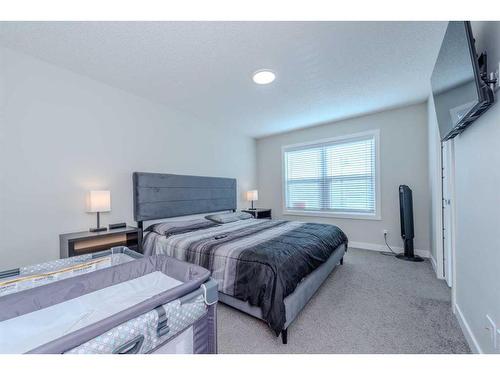 831 Creekside Boulevard Sw, Calgary, AB - Indoor Photo Showing Bedroom