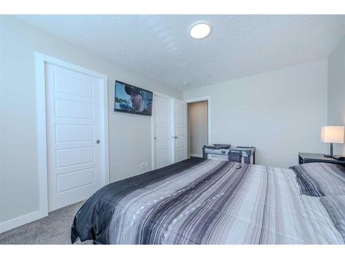 831 Creekside Boulevard Sw, Calgary, AB - Indoor Photo Showing Bedroom