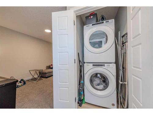 831 Creekside Boulevard Sw, Calgary, AB - Indoor Photo Showing Laundry Room